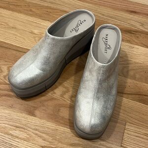 Coach Silver platform clogs.